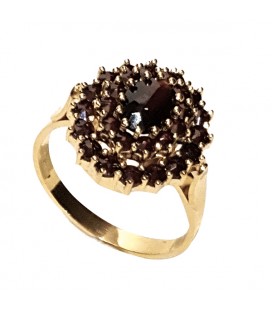 Bague grenat ovale fleur griffée