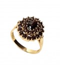 Bague grenat ovale fleur griffée